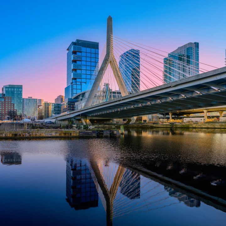 Boston,City,Sunset,Skyline,Over,Zakim,Bridge,And,The,Charles